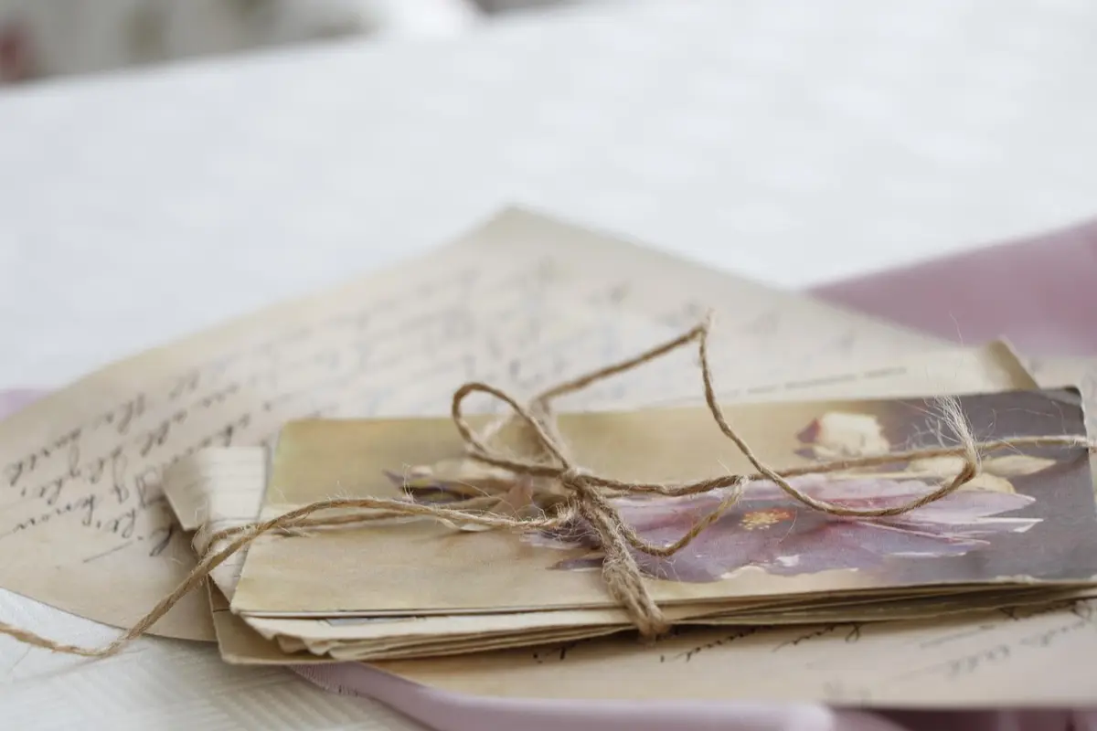 A stack of old handwritten letters tied with string