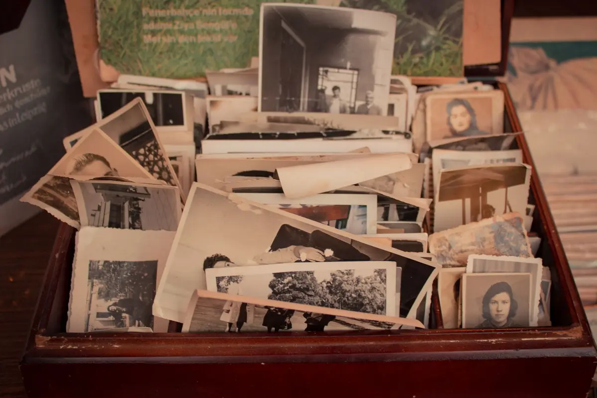 A wooden box full of old photographs and keepsakes